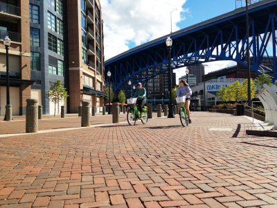 Bike riding on brick paved street